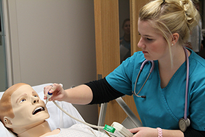 Nursing student working in the simulation lab