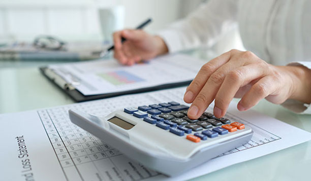 Person working on a calculator