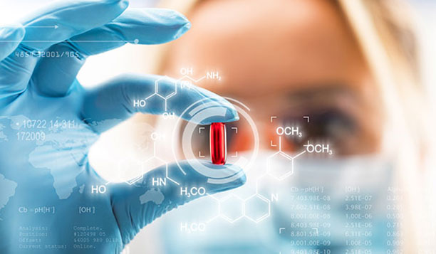 Scientist holding a red pill