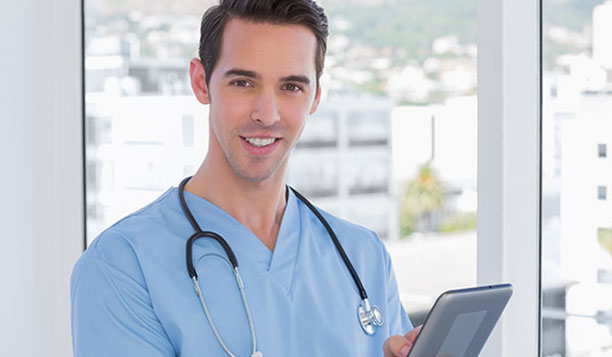 Smiling doctor holding a tablet