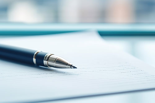 Pen and paper on a table