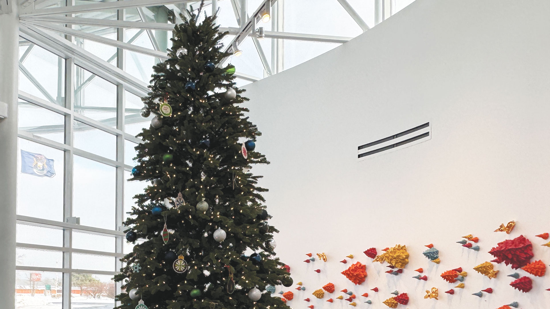 The Escanaba campus Bay College Christmas Tree sparkles in the Besse Gallery.