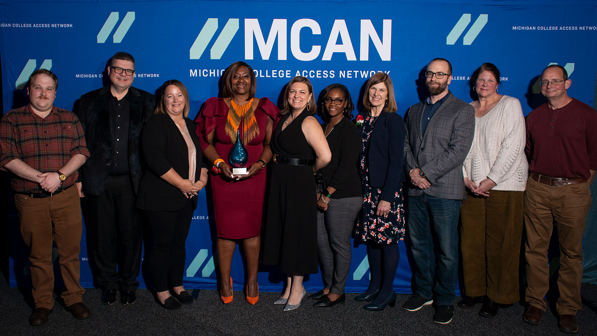 Bay College staff, faculty, President, MCAN staff and board members, and MCCA President.