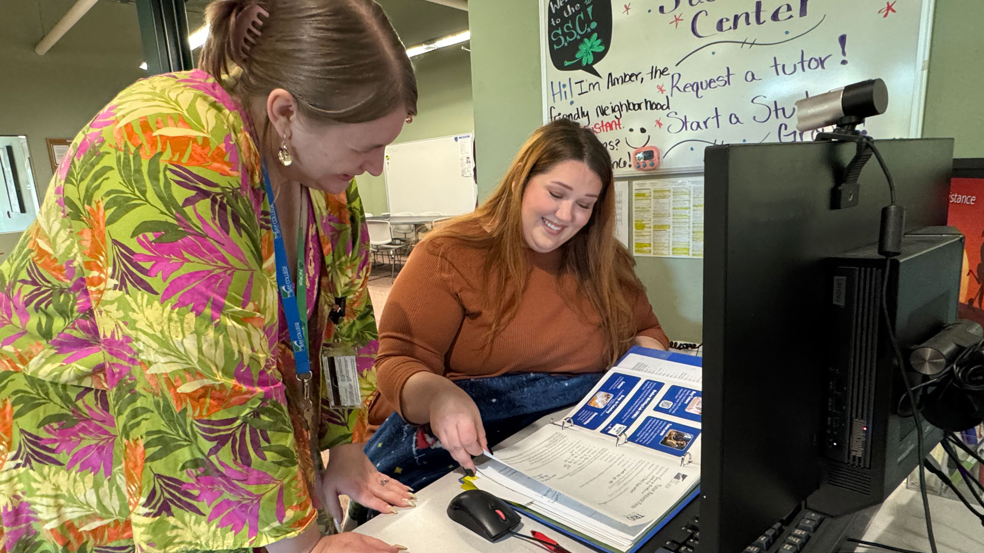 A Bay College Iron Mountain advisor helps a student in the Student Success Center.