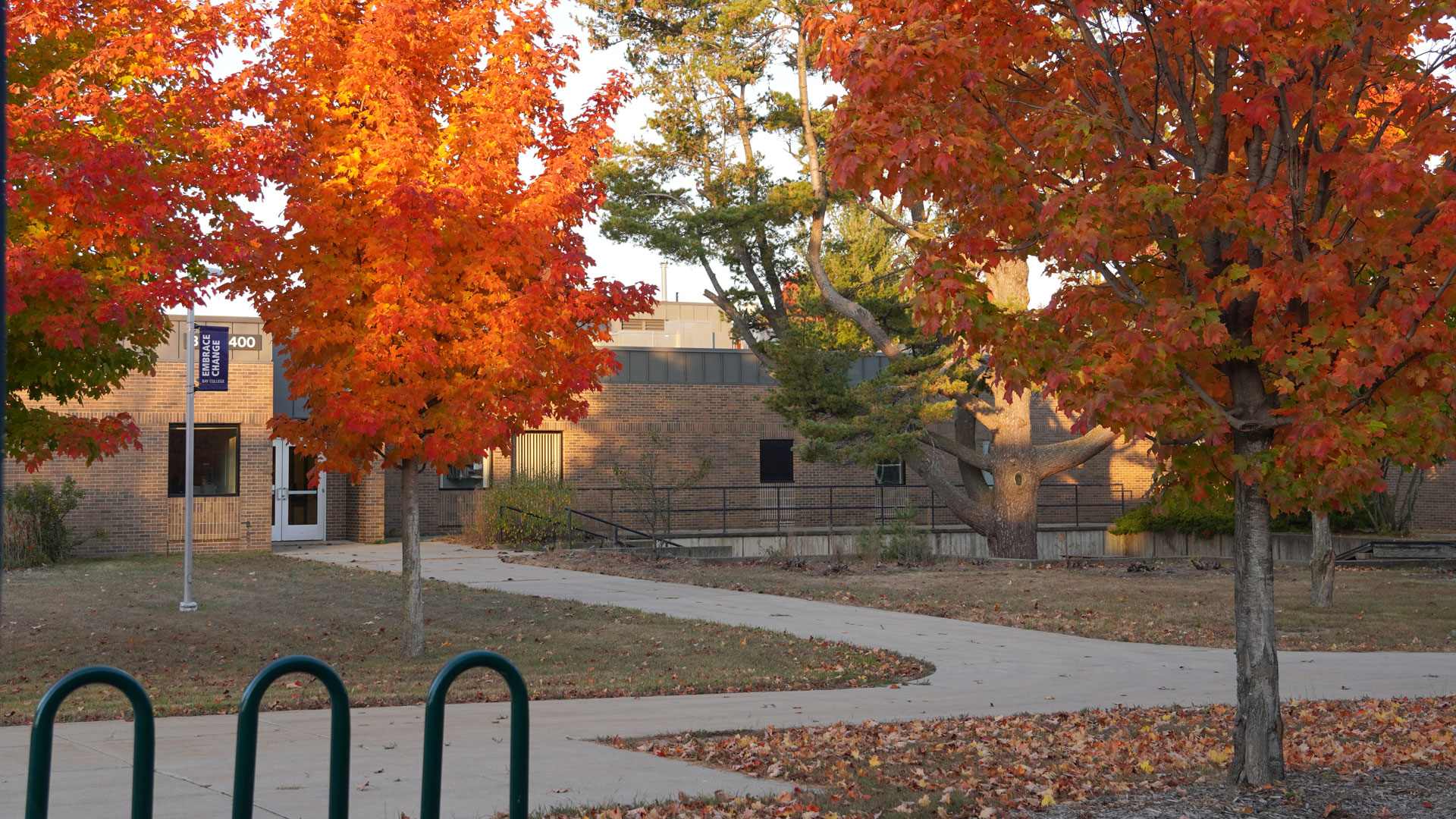 Fiery orange maple trees surround the Besse Health and Technology building on the Bay College Escanaba campus, also known as BHAT, or the 400 Building, where the training will be held.