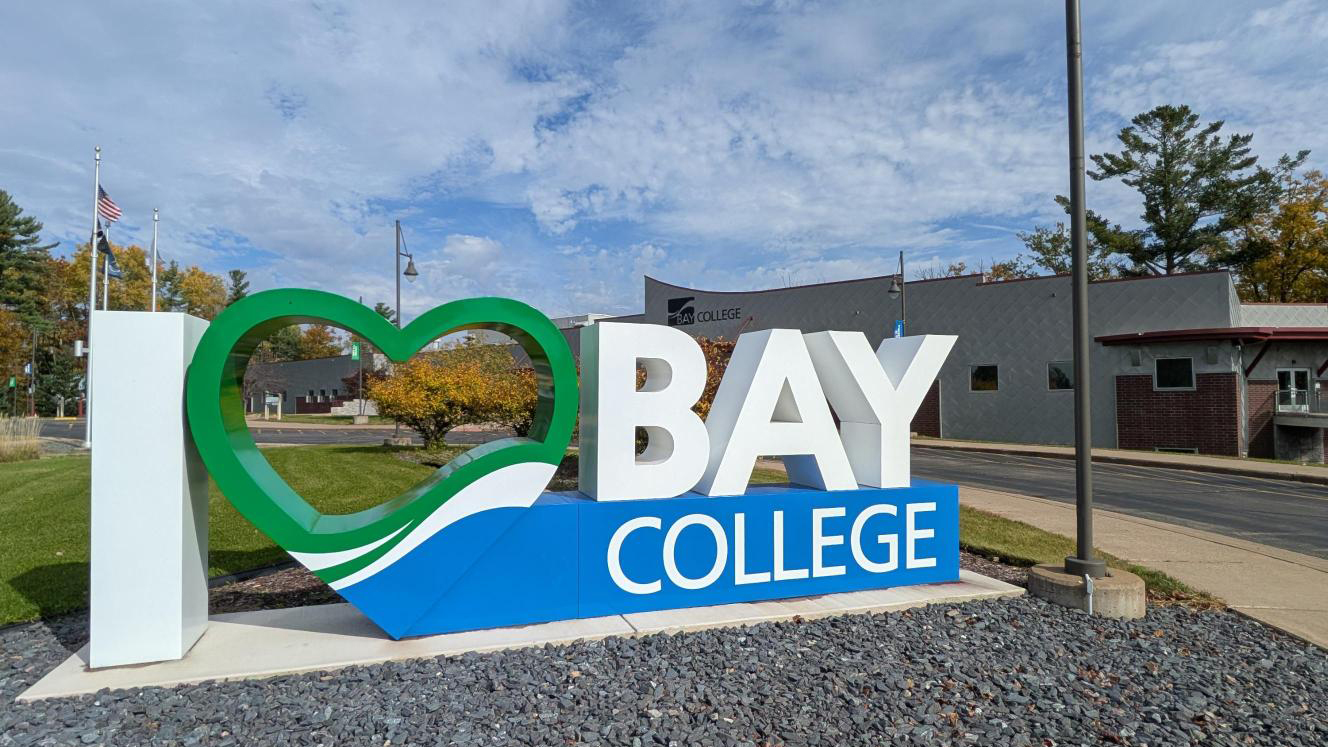 The "I Love Bay College" sign in front of the Bay College Iron Mountain Campus.