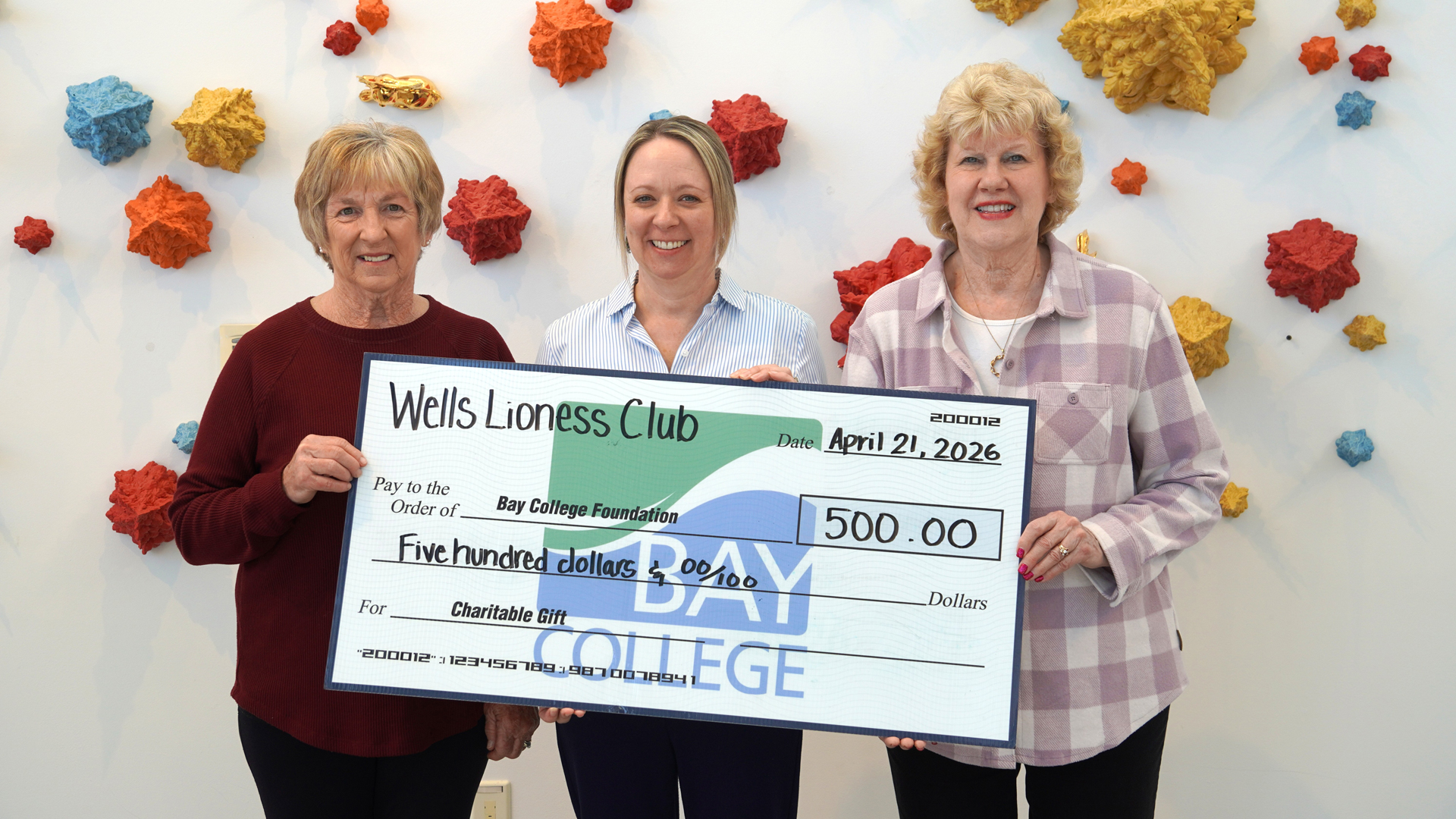 Shown from left to right are Wells Lioness President Mary Smith, Bay College Executive Director of Foundation and Alumni Relations Vicki DeGrand, and Wells Lioness Treasurer Marilyn Dutkavich, presenting a $500 check to the Bay College Foundation.