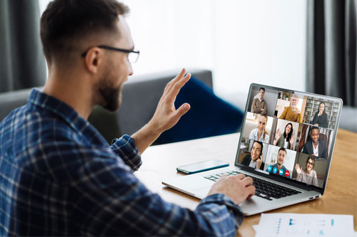 Person using a laptop for a virtual meeting