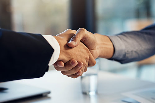 Two people shaking hands