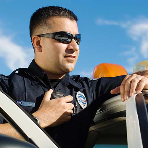 Police officer using a radio