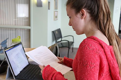 Female student using a laptop
