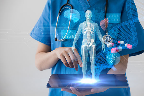 Health care student with tablet showing medical technology images