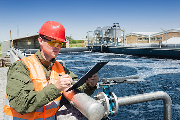 A water treatment facility manager controlling the quality of water