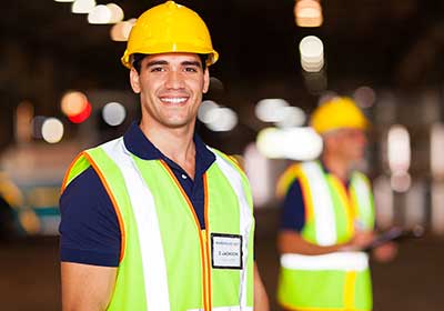 Man wearing hard hat and safety vest