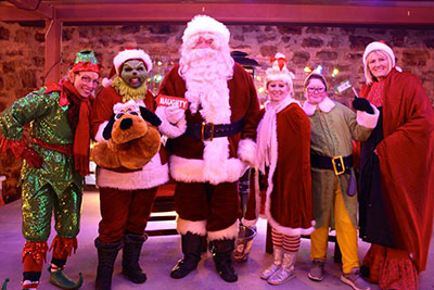 People dressed up as Christmas characters