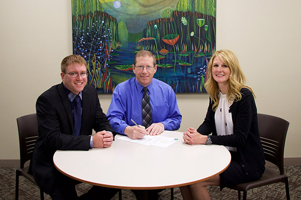 Dr. Matt Barron (left) is pictured in black suit next to MARESA's Brian Sarvello and Bay College's Dean of Business and Technology Cindy Carter.