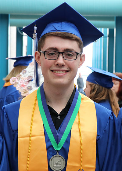 Mitch Monroe graduating at Bay College
