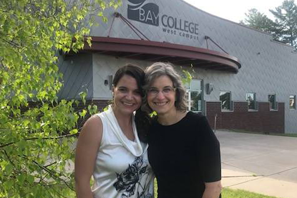 Amber Hansen and Laura Moloney outside of Bay College West