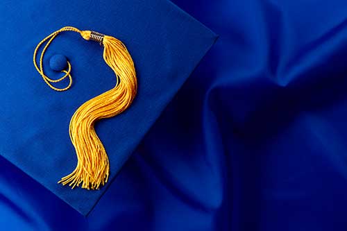 Blue graduation cap with gold tassel