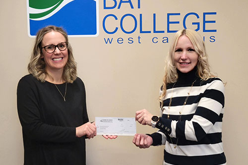 Danielson Insurance Agent, Shana Thompson-Hegy presents a scholarship check to the Dean of Bay College West Campus, Gina Wollner